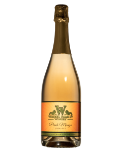 a bottle of Peach-Mango champagne / sparkling wine